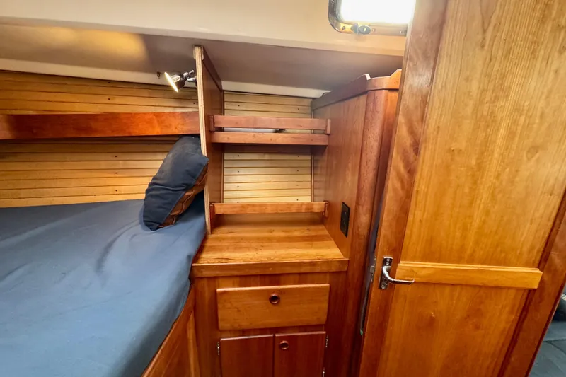 Slide: The Image of Cozy Sabre 402 yacht cabin interior with wooden furnishings, 2000 model. - 21
