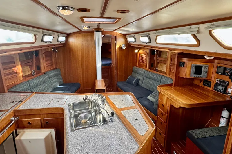 Slide: The Image of Luxurious interior of a 2000 Sabre 402 yacht with wood finishes and modern amenities. - 27