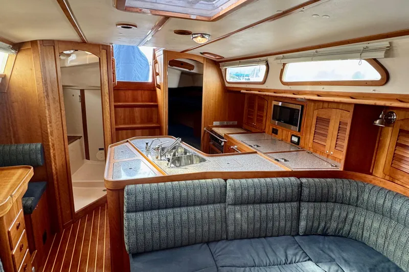 Slide: The Image of Luxurious interior of a 2000 Sabre 402 yacht with wood finishes and modern amenities. - 28