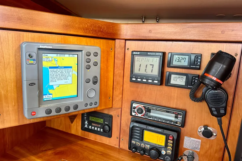 Slide: The Image of Navigation and communication equipment on a 2000 Sabre 402 yacht control panel. - 41