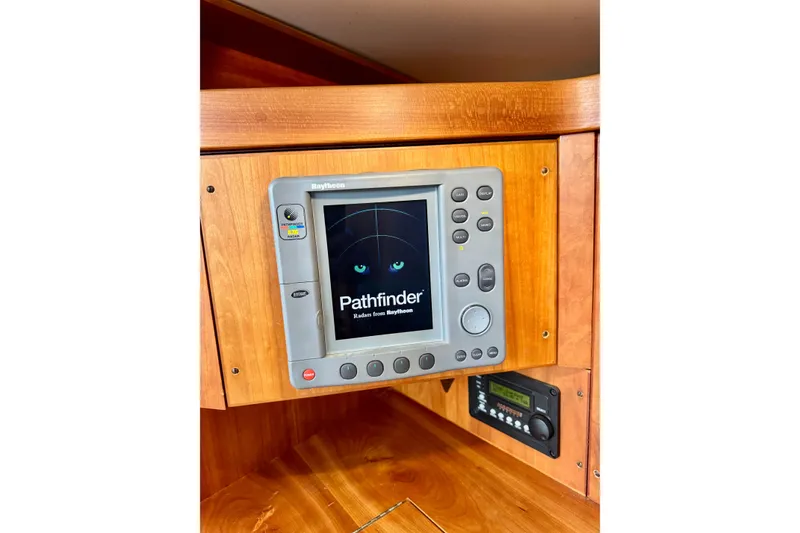 Slide: The Image of Raytheon Pathfinder radar display on 2000 Sabre 402 yacht, mounted in wooden panel. - 42