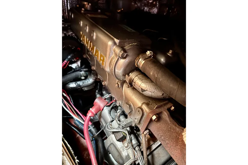 Slide: The Image of Engine of a 2000 Sabre 402 boat, featuring Yanmar components. - 48