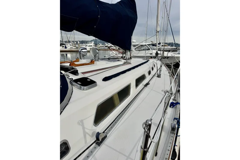 Slide: The Image of Sailboat deck view of 2000 Sabre 402, docked in a marina. - 9