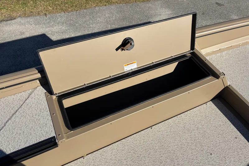 Slide: The Image of Open storage compartment on 2026 SeaArk DXS 1548 DKLD boat, showing interior space. - 12