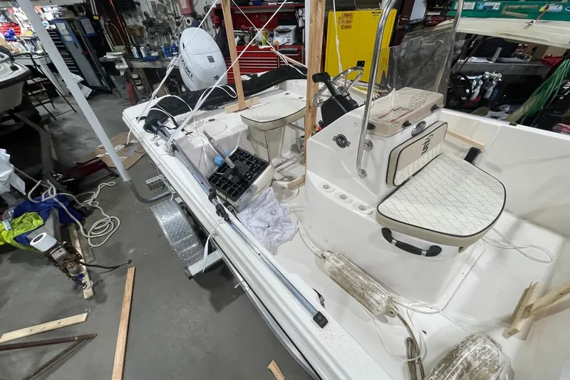 Slide: The Image of 2021 Carolina Skiff 162 JLS boat interior in a workshop setting. - 7