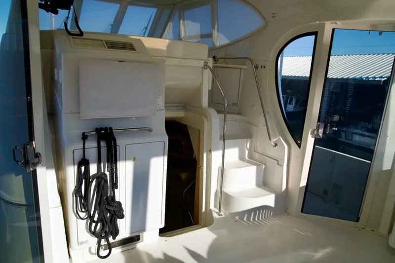 Slide: The Image of Interior view of 2000 Carver 506 Motor Yacht with stairs and nautical ropes. - 14