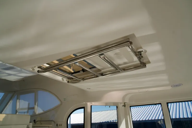 Slide: The Image of Ceiling view inside 2000 Carver 506 Motor Yacht, featuring a metal hatch. - 15