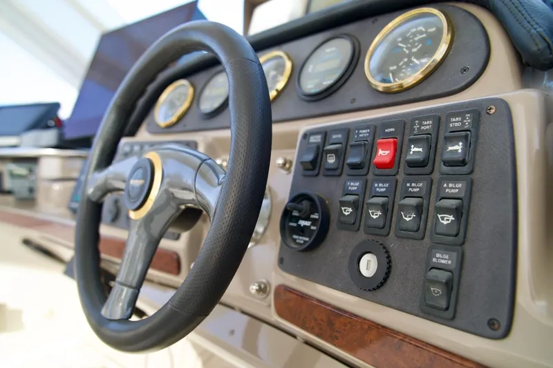 Slide: The Image of Steering wheel and control panel of 2000 Carver 506 Motor Yacht. - 27