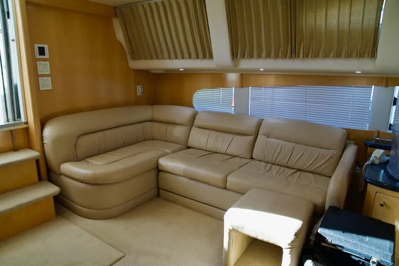 Slide: The Image of Luxurious interior of 2000 Carver 506 Motor Yacht with beige leather seating. - 38