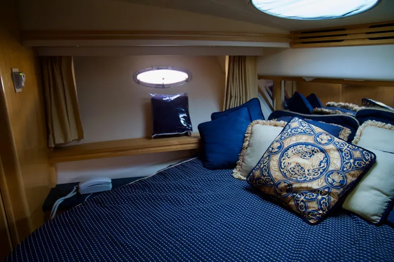 Slide: The Image of Luxurious bedroom interior of 2000 Carver 506 Motor Yacht with elegant pillows and bedding. - 43