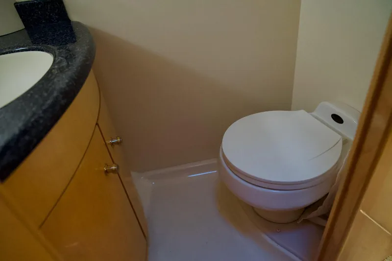 Slide: The Image of Bathroom interior of 2000 Carver 506 Motor Yacht with toilet and sink. - 48