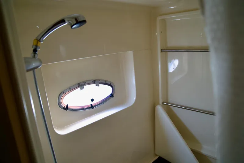 Slide: The Image of Bathroom interior of 2000 Carver 506 Motor Yacht with shower and porthole window. - 57