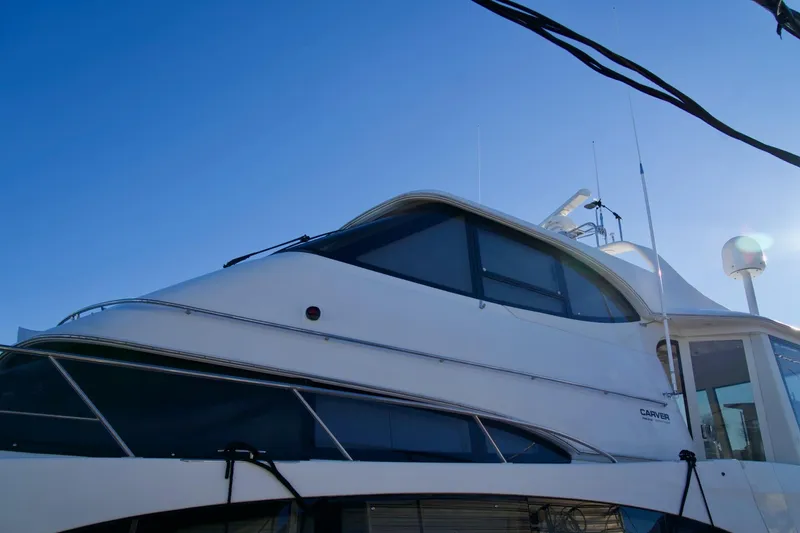 Slide: The Image of 2000 Carver 506 Motor Yacht against clear blue sky. - 6