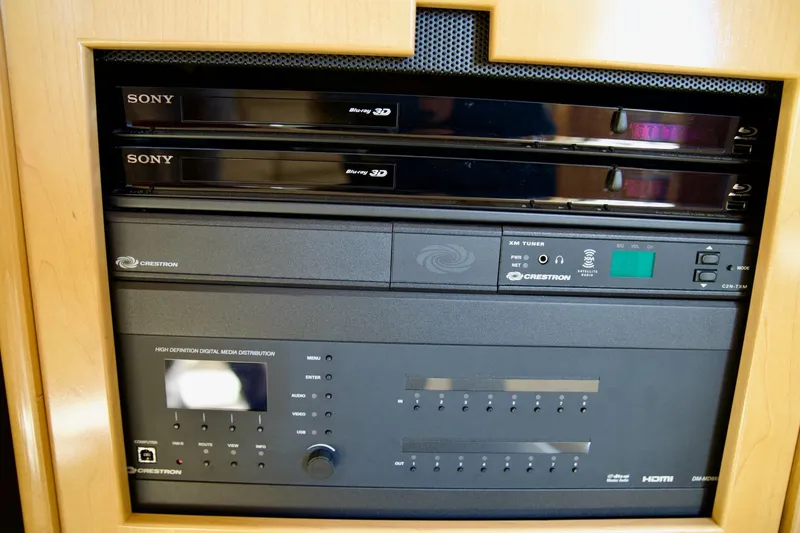 Slide: The Image of Entertainment system with Sony Blu-ray players and Crestron media distribution in 2000 Carver 506 Motor Yacht. - 67