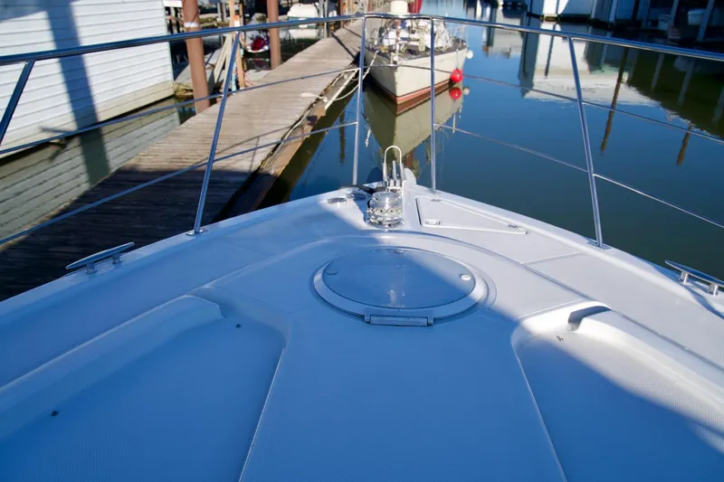 Slide: The Image of Bow view of 2000 Carver 506 Motor Yacht docked at marina. - 12