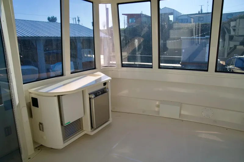 Slide: The Image of Interior of 2000 Carver 506 Motor Yacht with windows and compact kitchenette. - 16