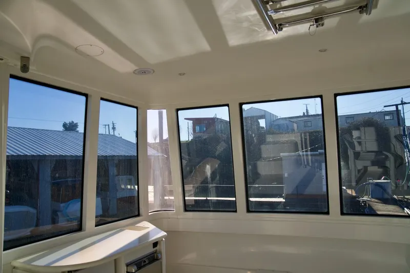 Slide: The Image of Interior view of 2000 Carver 506 Motor Yacht with large windows and natural light. - 18