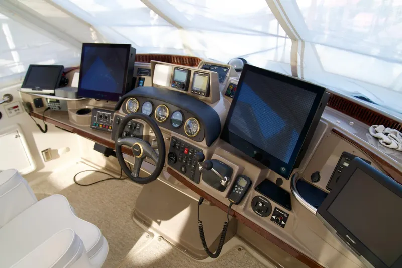 Slide: The Image of Cockpit of 2000 Carver 506 Motor Yacht with advanced navigation equipment. - 21