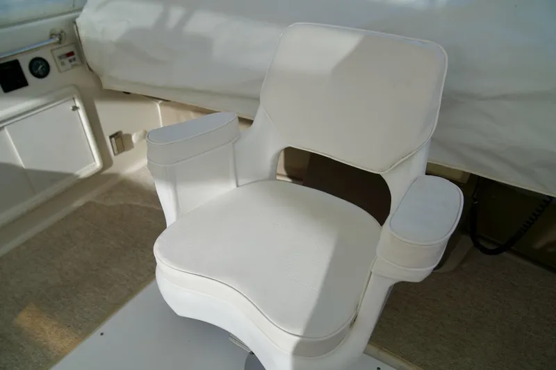 Slide: The Image of White captain's chair on 2000 Carver 506 Motor Yacht bridge. - 31