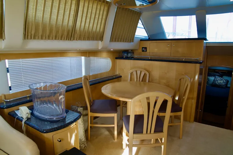 Slide: The Image of Luxurious interior of 2000 Carver 506 Motor Yacht with dining area and elegant furnishings. - 34