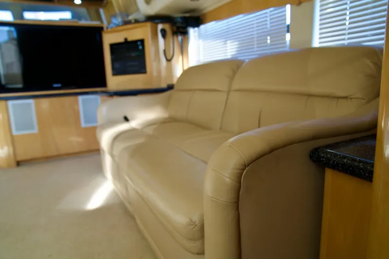 Slide: The Image of Luxurious interior of 2000 Carver 506 Motor Yacht with beige leather sofa. - 39