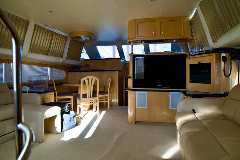 Slide: The Image of Luxurious interior of 2000 Carver 506 Motor Yacht with modern furnishings and entertainment system. - 40