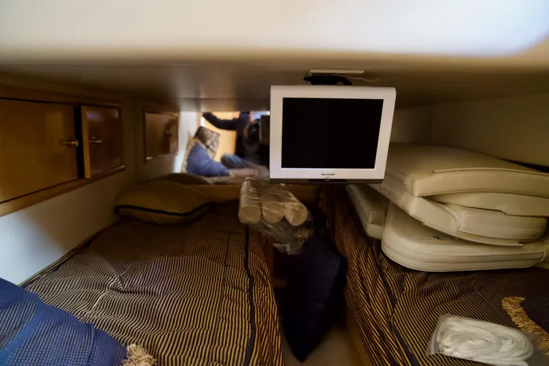 Slide: The Image of Interior cabin of 2000 Carver 506 Motor Yacht with beds and TV. - 50