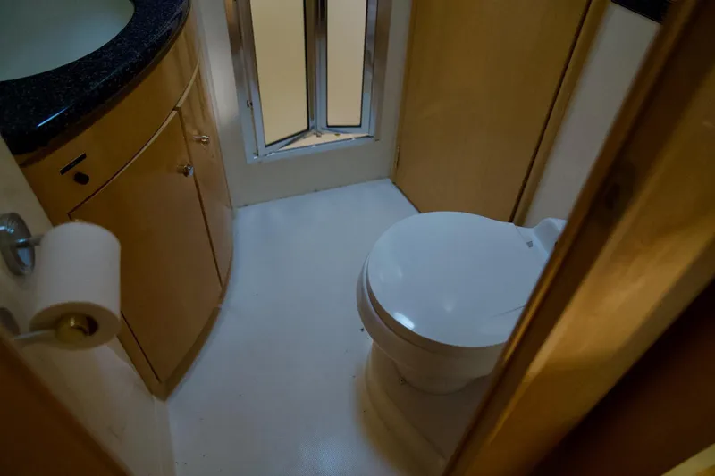 Slide: The Image of Bathroom interior of 2000 Carver 506 Motor Yacht with toilet and sink. - 54
