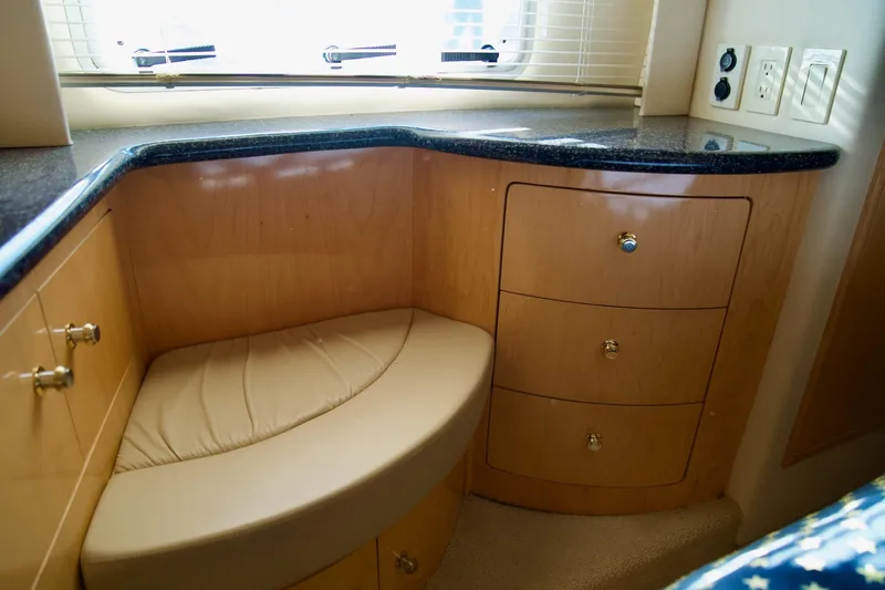 Slide: The Image of Interior of 2000 Carver 506 Motor Yacht with wood cabinetry and cushioned seating. - 59