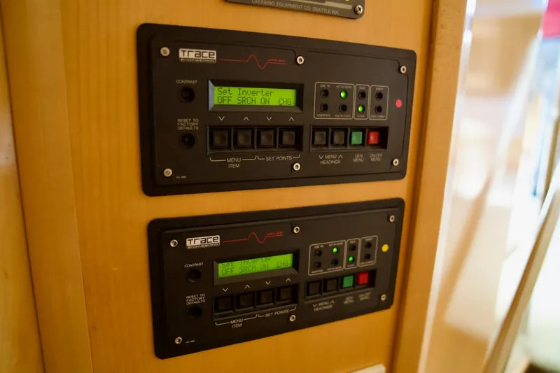 Slide: The Image of Control panels on a 2000 Carver 506 Motor Yacht, displaying inverter settings. - 64
