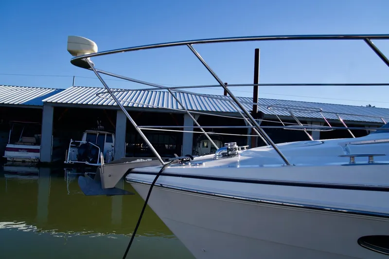 Slide: The Image of 2000 Carver 506 Motor Yacht docked at marina, clear blue sky background. - 8