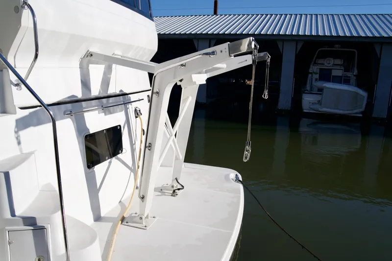 Slide: The Image of Carver 506 Motor Yacht 2000 with davit system, docked in marina. - 9