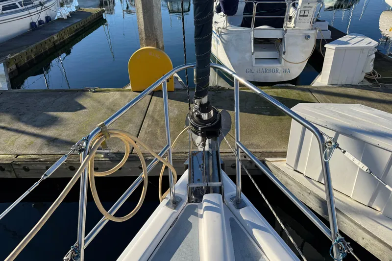 Slide: The Image of Bow of a 2005 Hunter 36 sailboat docked at a marina. - 18