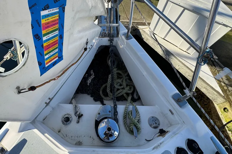 Slide: The Image of Anchor locker of a 2005 Hunter 36 sailboat with ropes and equipment. - 19