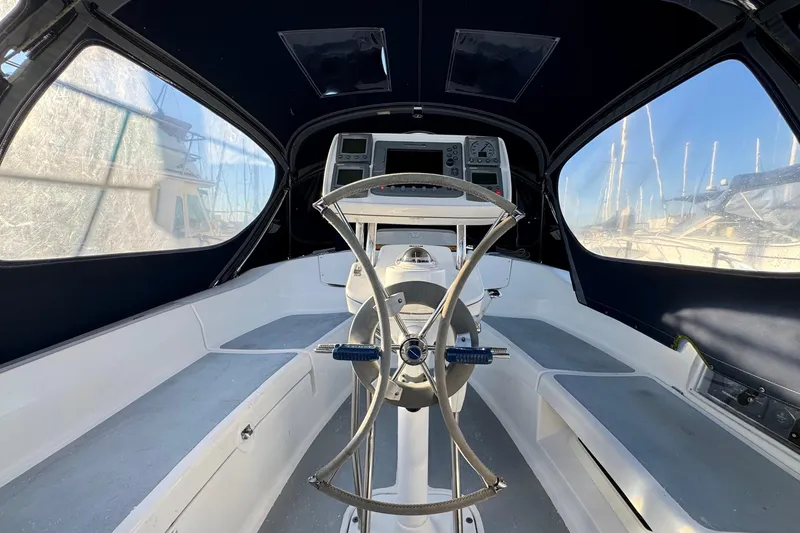 Slide: The Image of Cockpit of 2005 Hunter 36 sailboat with steering wheel and navigation instruments. - 23