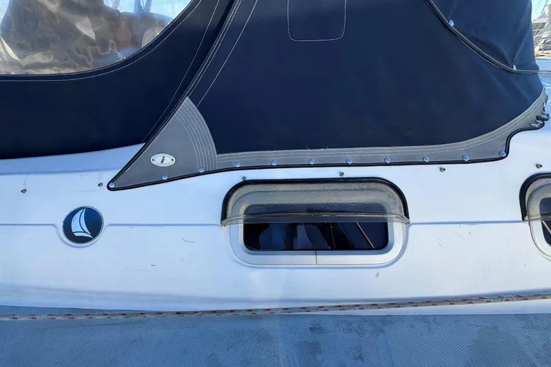 Slide: The Image of Close-up of a 2005 Hunter 36 sailboat window and canvas cover. - 28