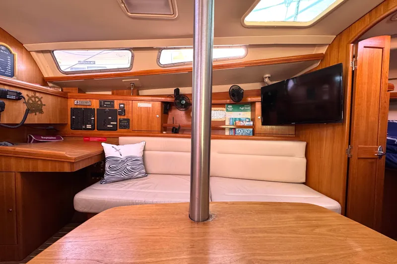 Slide: The Image of Interior of a 2005 Hunter 36 sailboat with wood finish and modern amenities. - 6