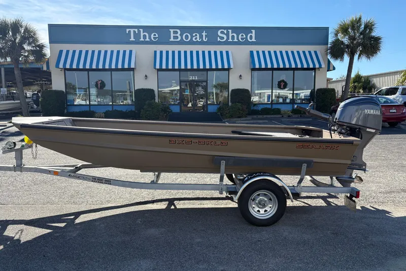 The Image of 2026 SeaArk DXS 1652 DKLD boat on trailer outside The Boat Shed. - 1