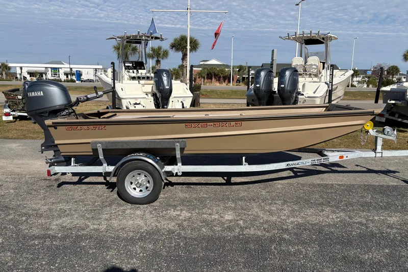 Slide: The Image of 2026 SeaArk DXS 1652 DKLD boat on trailer with Yamaha outboard motor. - 5