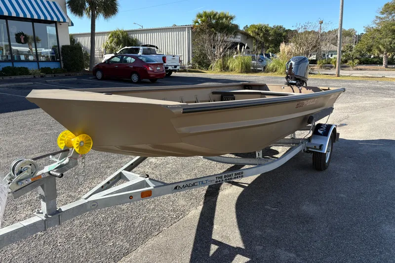 Slide: The Image of 2026 SeaArk DXS 1652 DKLD boat on trailer in sunny parking lot. - 8