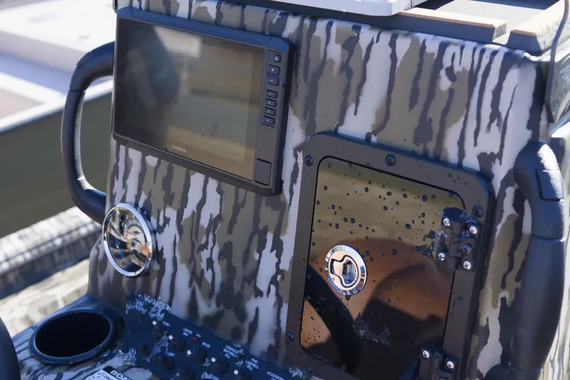 Slide: The Image of Control panel of 2026 Avid 20 Rogue CC boat with camouflage design. - 7