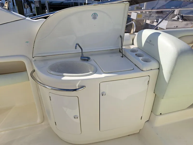 Slide: The Image of 2003 Cranchi Endurance 39 yacht cockpit with steering wheel and navigation controls. - 11