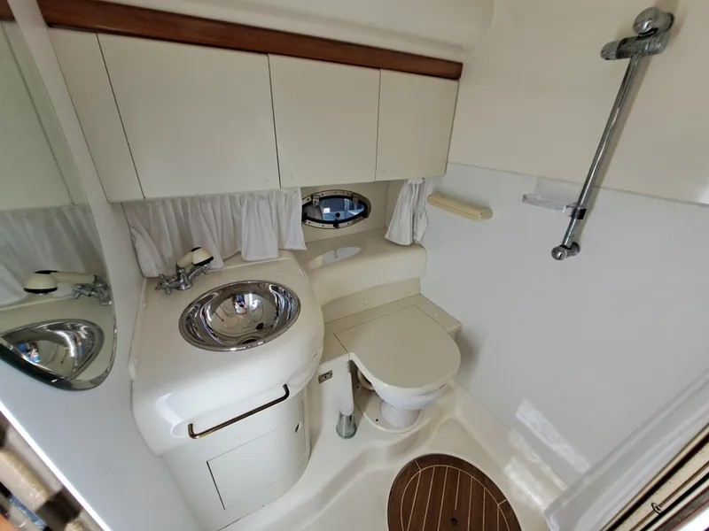 Slide: The Image of Bathroom interior of 2003 Cranchi Endurance 39 yacht with sink, toilet, and shower. - 27