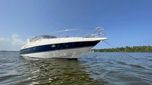 Slide: The Image of 2003 Cranchi Endurance 39 yacht anchored on calm water. - 3