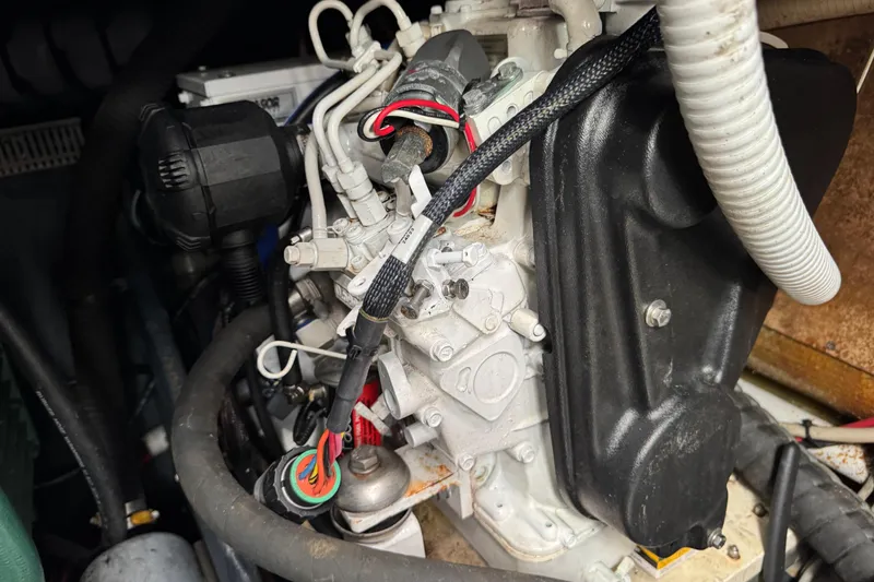 Slide: The Image of Engine compartment of a 2003 Cranchi Endurance 39 boat, showing detailed components and wiring. - 32