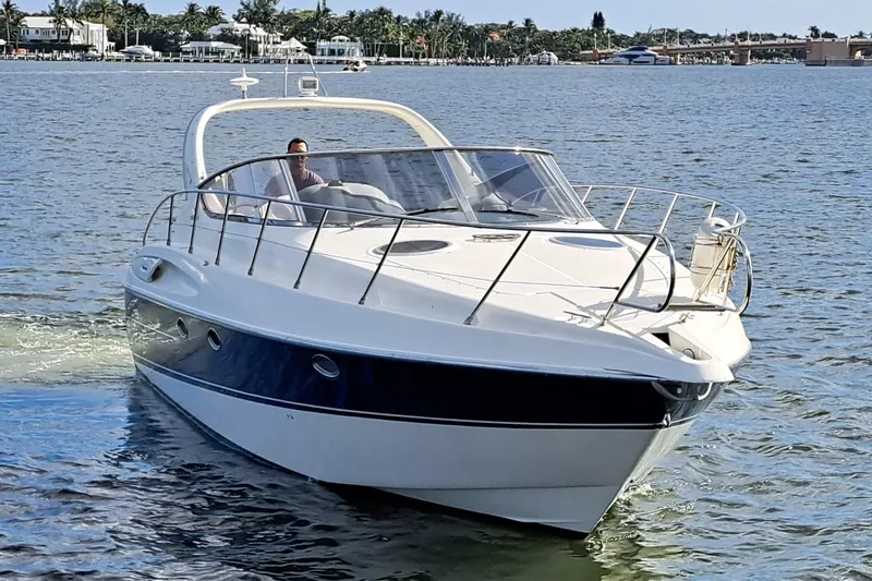 Slide: The Image of 2003 Cranchi Endurance 39 yacht docked in Palm Beach, Florida, with American flag. - 5