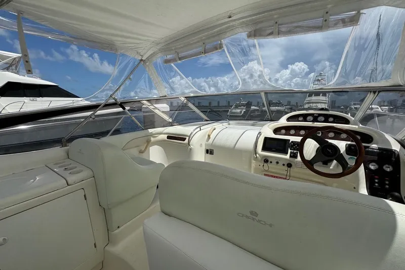 Slide: The Image of 2003 Cranchi Endurance 39 docked in Palm Beach, FL, with open storage compartment. - 7