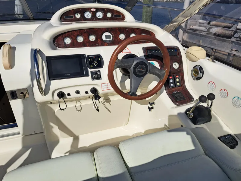 Slide: The Image of 2003 Cranchi Endurance 39 docked in Palm Beach marina, featuring open deck and colorful mats. - 8