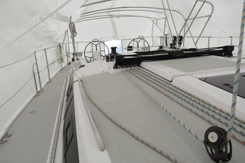Slide: The Image of 2019 Catalina 425 yacht deck with steering wheel and rigging under canopy. - 14