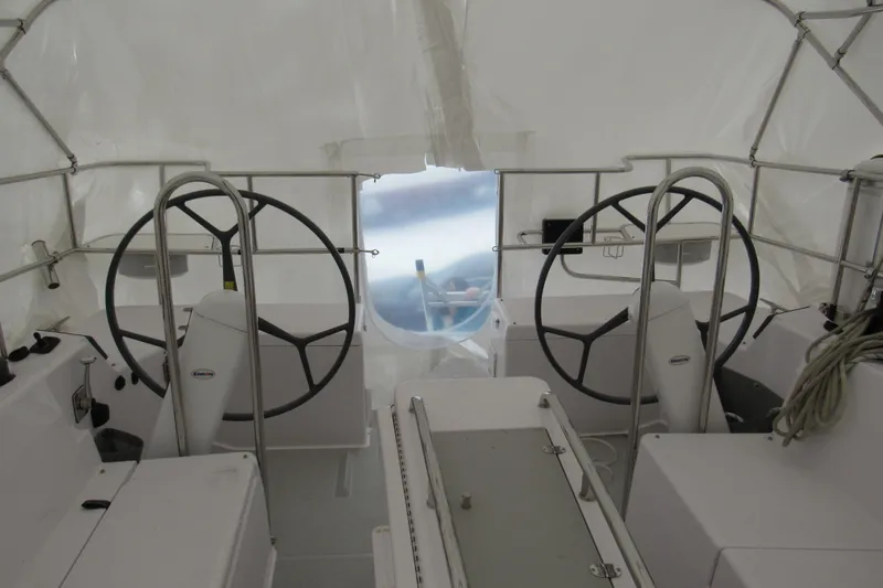 Slide: The Image of Interior view of a 2019 Catalina 425 sailboat cockpit with dual steering wheels. - 15